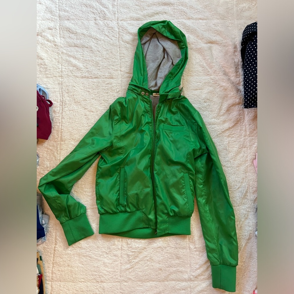 green zip-up jacket